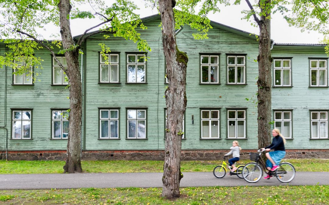Picture of child and parent cycling to school in Estonia